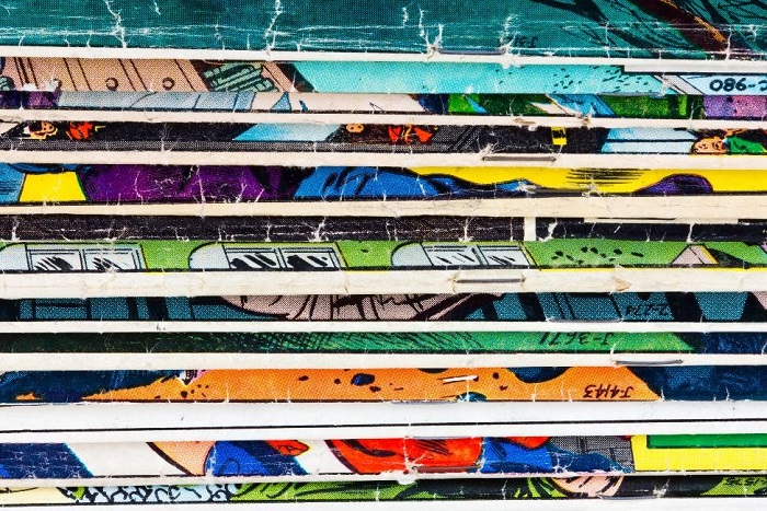 stack of superhero comic books